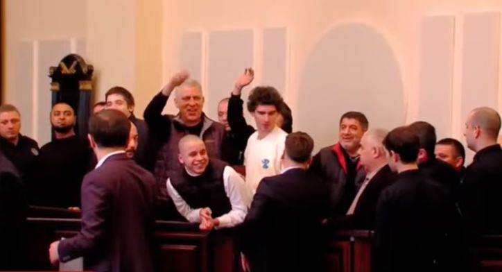 Eight protesters remain in custody on charges of organizing group violence
